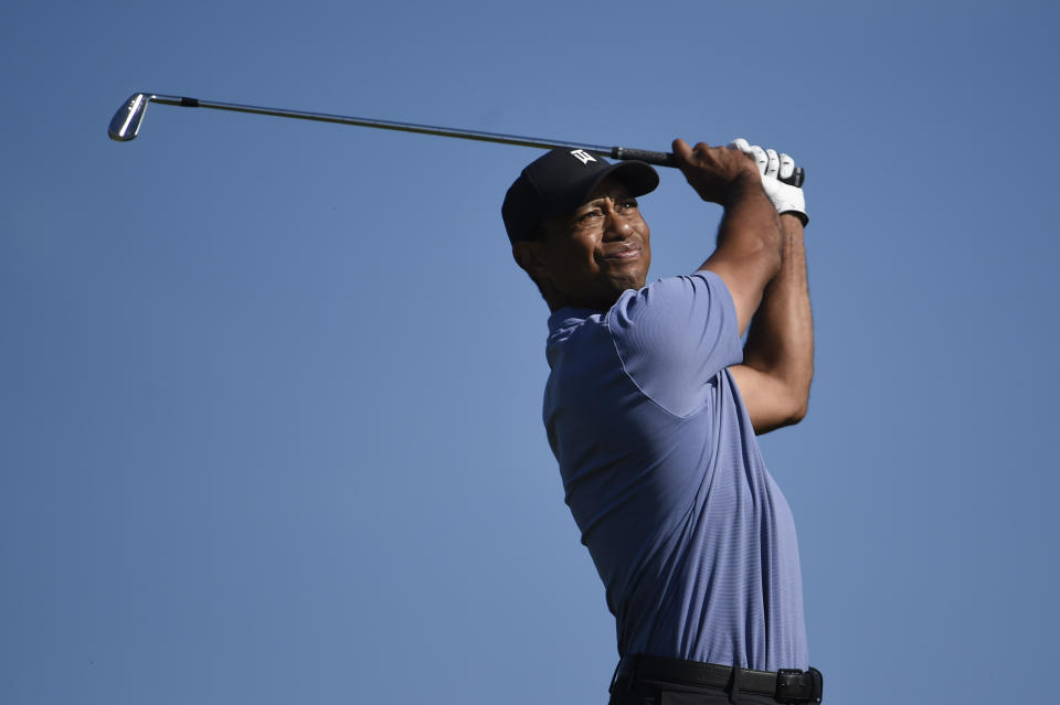 Tiger Woods hits hit tee shot on the 15th hole of the North Course at Torrey Pines Golf Course during the first round of the Farmers Insurance golf tournament Thursday Jan. 23, 2020, in San Diego. (AP Photo/Denis Poroy)