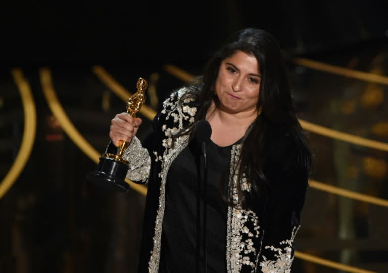 Journalist and filmmaker Sharmeen Obaid-Chinoy accepts her award for Best Documentary Short Subject, 'A Girl in the River', on stage at the 88th Oscars, in Hollywood, California, on February 28, 2016