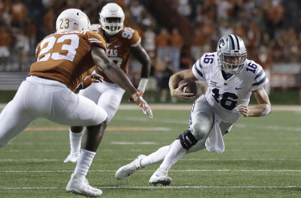Kansas State quarterback Jesse Ertz (16) keeps the ball as he runs past Texas linebacker Jeffrey McCulloch (23) during the first half of an NCAA college football game, Saturday, Oct. 7, 2017, in Austin, Texas. (AP Photo/Eric Gay)