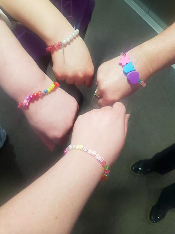 Staff at Oakwood Grange wearing the friendship bracelets made by Jess. (Image supplied Donna Harrison-Rhodes/Anchor Hanover)