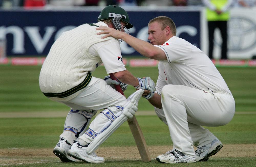 Andrew Flintoff consoles Brett Lee after England win the second Ashes Test match of 2005 at Edgbaston.