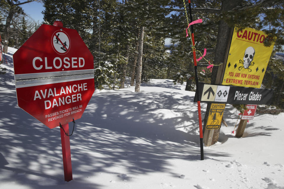 FILE- In this Feb. 26, 2014, file photo, a sign alerts skiers to danger on Corona Bowl, known for its extreme skiing, at Eldora Mountain Resort, near Nederland, Colo. This has been an highly dangerous avalanche season, with 30 confirmed fatalities. It's involved different recreational activities — snowboarding, skiing, snowmobiling, hiking — and includes various ages and experience levels. A warning from avalanche experts for anyone venturing into the backcountry: The threat of slides may only be growing worse. (AP Photo/Brennan Linsley, File)