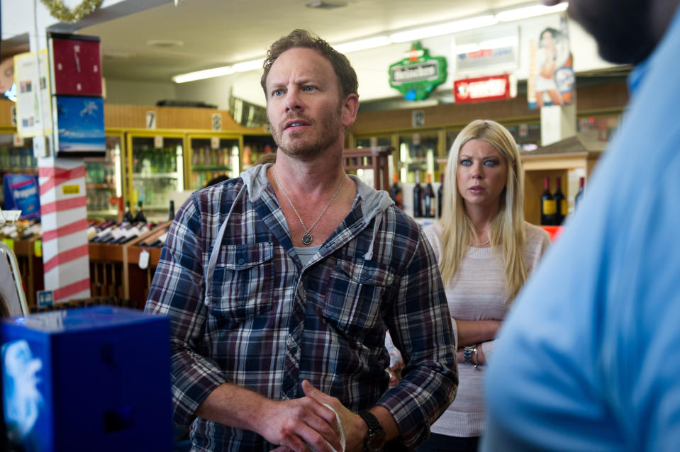 This photo released by Syfy shows Ian Ziering, left, as Fin, Tara Reid as April in a scene from the Syfy original movie, "Sharknado." "Sharknado 2: The Second One" will take a bite out of New York City on July 30, 2014, in Syfy's sequel to the campy classic that aired last summer. (AP Photo/Syfy)