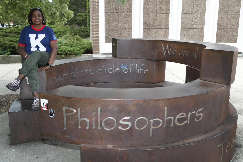 Karen Calloway, principal of Kenwood Academy in Chicago, poses Tuesday, July 28, 2020, for a portrait by the school's Inspirational Circle, designed by Kenwood students in 2003, in the Hyde Park neighborhood campus. School districts around the U.S. are working to remove police officers from campuses, but the school council for Kenwood Academy, a predominantly Black school near the University of Chicago, recently unanimously voted to keep its officer. (AP Photo/Charles Rex Arbogast)