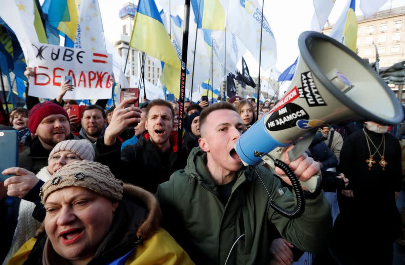 People take part in a rally ahead of the so-called "Normandy" format summit, in Kiev