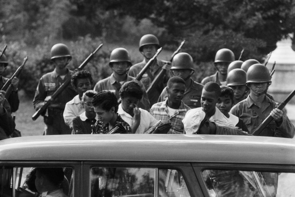 PHOTO: Nine Black students attending Arkansas Central High School are shown leaving the school under protection of Federalized Arkansas National Guardsmen, Oct. 9, 1957, in Little Rock, Ark.  (Bettmann Archive/Getty Images)