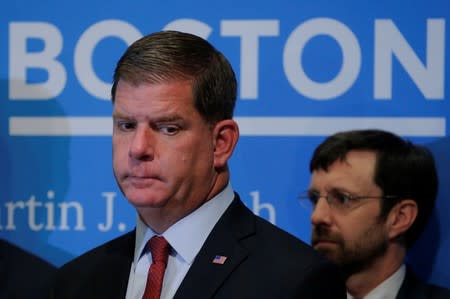 FILE PHOTO: Boston Mayor Walsh listens during a news conference to urge U.S. President Trump not to withdraw from the Paris Climate Accord at City Hall in Boston