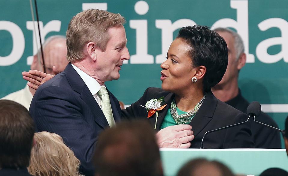 State Sen. Linda Dorcena Forry, right, thanks Prime Minister Enda Kenny of Ireland after Kenny spoke at the annual St. Patrick's Day Breakfast in Boston, Sunday, March 16, 2014. (AP Photo/Michael Dwyer)