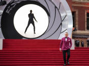 Daniel Craig poses for photographers upon arrival for the World premiere of the film 'No Time To Die', in London Tuesday, Sept. 28, 2021. (AP Photo/Matt Dunham)