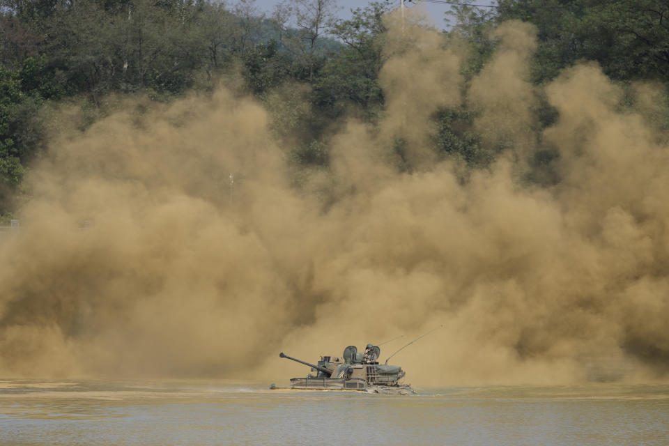 South Korea's K21 infantry fighting vehicle sails to shores in a smoke during the combined wet gap crossing military drill between South Korea and the United States as a part of the Ulchi Freedom Shield military exercise in Cheorwon, South Korea, on Aug. 31, 2023. (AP Photo/Lee Jin-man)