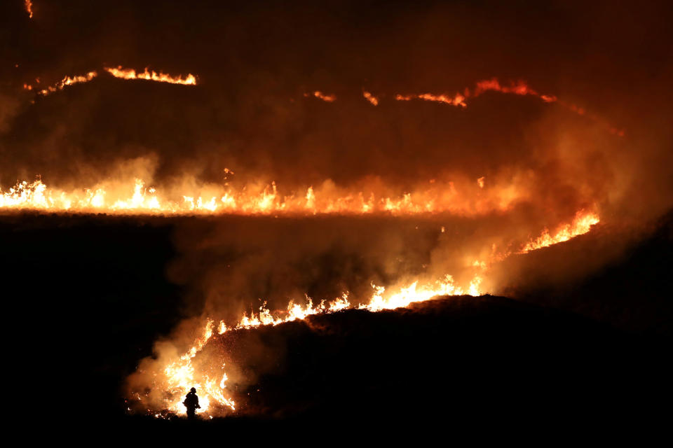 A fire is seen burning on Saddleworth Moor near the town of Diggle, Britain, February 27, 2019.&nbsp;