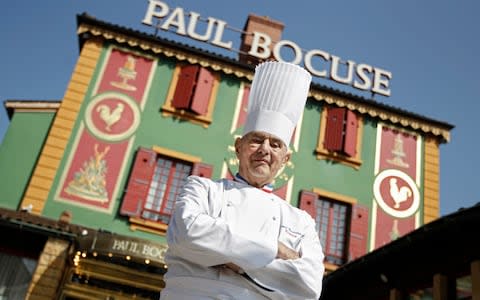 French Chef Paul Bocuse poses outside his famed Michelin three-star restaurant L'Auberge du Pont de Collonges in Collonges-au-Mont-d'or, central France  - Credit: Laurent Cipriani&nbsp;/AP