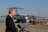 FILE - In this Dec. 12, 2017, file photo, Russian President Vladimir Putin addresses the troops at the Hemeimeem air base in Syria. In an interview on Russian state television, Putin, ahead of his June 16, 2021, meeting with President Joe Biden, issued a strong, new warning that the prospect of Ukraine joining NATO was unacceptable for Russia. (Mikhail Klimentyev/Pool Photo via AP, File)