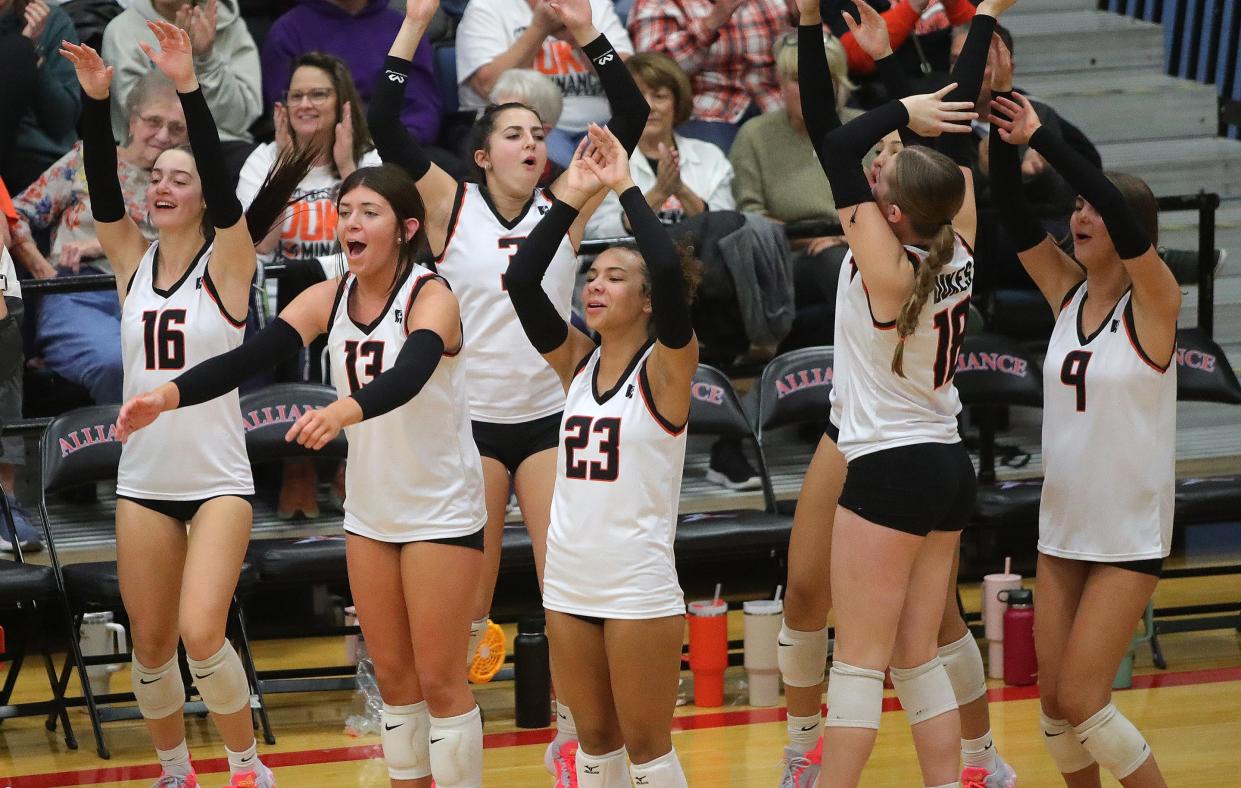 The Marlington bench reacts after a point during a five-set win over Kenston in a regional semifinal, Thursday, Nov. 2, 2023.