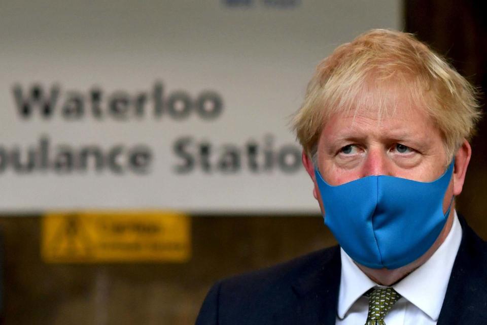 Boris Johnson wears a face mask during a visit to the headquarters of the London Ambulance Service NHS Trust (PA)