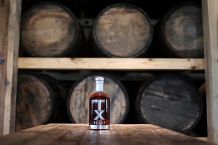 A bottle of TX Whiskey is photographed in the TX Tavern at the Firestone & Robertson (F&R) Whiskey Ranch in Forth Worth, Texas, U.S., May 24, 2018. Picture taken May 24, 2018. REUTERS/Adrees Latif