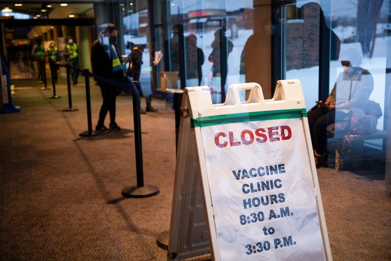 FILE PHOTO: People line up for vaccines at a mass vaccination site in Michigan