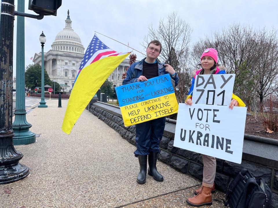 Robert Harvey (left) and Sasha Kordiiaka (right) stand outside the U.S. Capitol Building on Thursday morning to encourage Congress to pass additional aid to Ukraine.