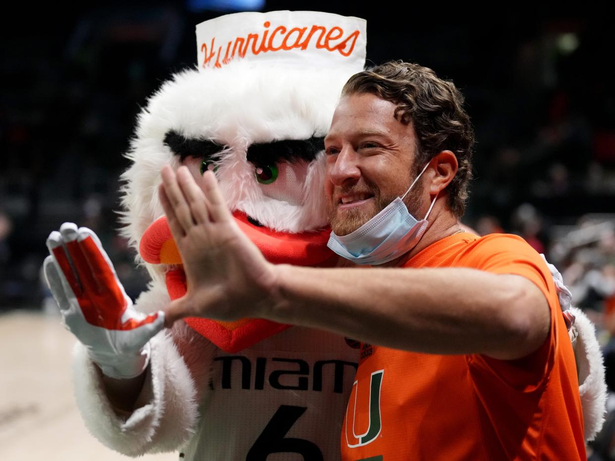 Barstool Sports founder Dave Portnoy poses with Sebastian the Mascot prior to the game between the Miami Hurricanes and the Florida State Seminoles at Watsco Center on January 22, 2022 in Coral Gables, Florida.