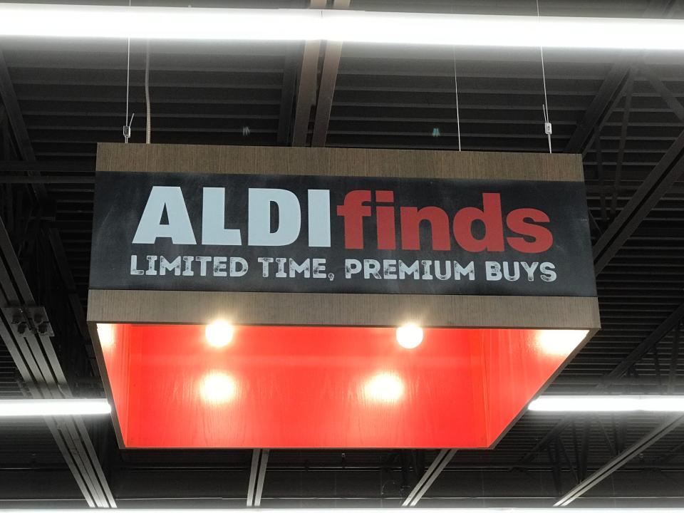 An Aldi Finds sign reads "Limited time, premium buys."