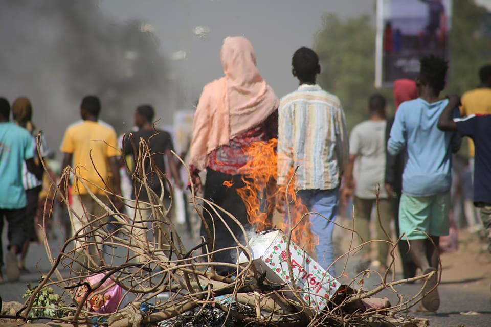 Pro-democracy protesters use fires to block streets to condemn a takeover by military officials in Khartoum, Sudan, Monday Oct. 25, 2021. Sudan’s military seized power Monday, dissolving the transitional government hours after troops arrested the acting prime minister and other officials. The takeover comes more than two years after protesters forced the ouster of longtime autocrat Omar al-Bashir and just weeks before the military was expected to hand the leadership of the council that runs the African country over to civilians. (AP Photo/Ashraf Idris)