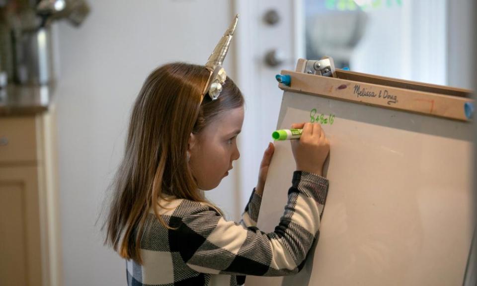 A girl learns maths at home during the Covid-19 lockdown.