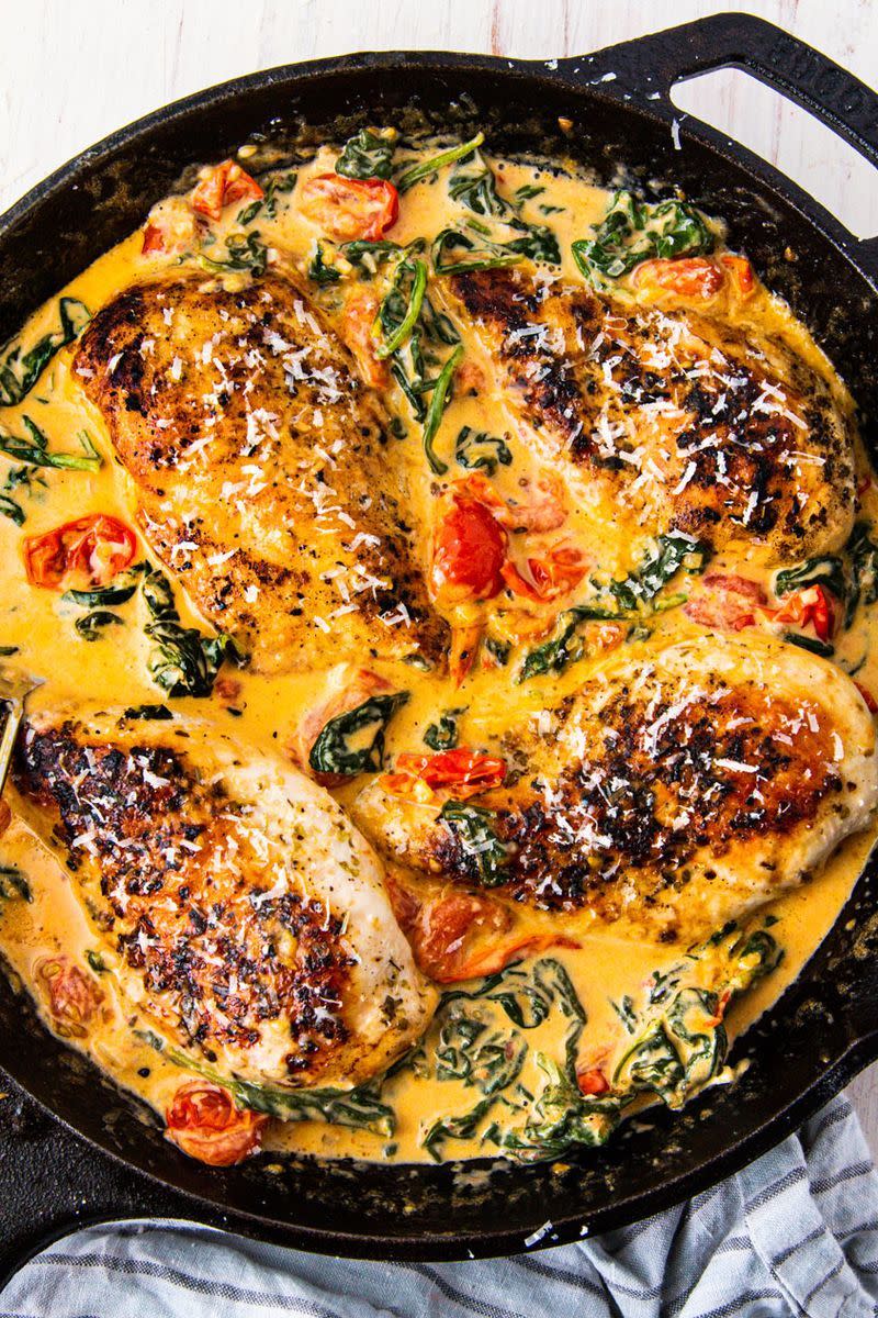 <p>When dinner is this good you'll actually want to cook for yourself. This skillet chicken is easy to make and comes together quickly. You'll have a sauce so delicious you'll want to drink it straight from the pan.</p><p>Get the <a href="https://www.delish.com/uk/cooking/recipes/a30131747/creamy-tuscan-chicken-recipe/" rel="nofollow noopener" target="_blank" data-ylk="slk:Creamy Tuscan Chicken;elm:context_link;itc:0;sec:content-canvas" class="link ">Creamy Tuscan Chicken</a> recipe.</p>