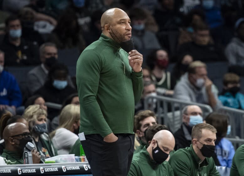 FILE - Milwaukee Bucks acting coach Darvin Ham watches during the first half of the team's NBA basketball game against the Charlotte Hornets on Jan. 8, 2022, in Charlotte, N.C. A person with knowledge of the decision says Ham has accepted an offer to be the next head coach of the Los Angeles Lakers. The person spoke with The Associated Press on Friday, May 27, on condition of anonymity because the deal has not been publicly announced. (AP Photo/Matt Kelley, File)