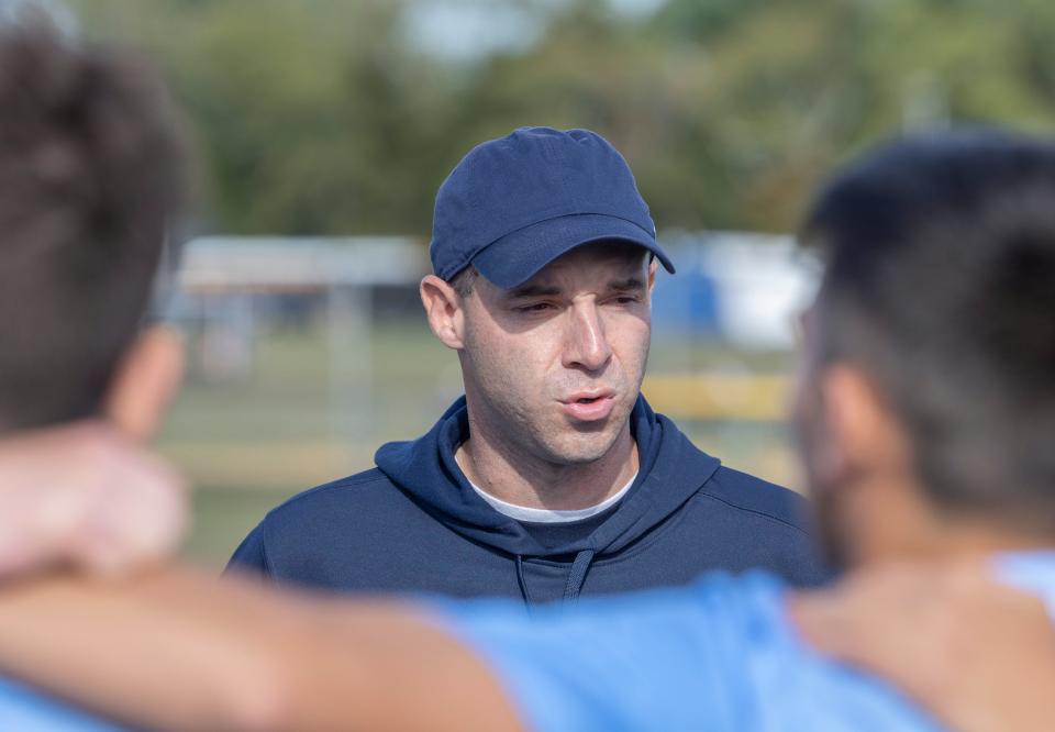 Freehold Township soccer coach Michael Tepedino talks to his team before the start of game. Freehold Township Boys Soccer defeats Marlboro 2-0 in Freehold Township on September  29, 2022.