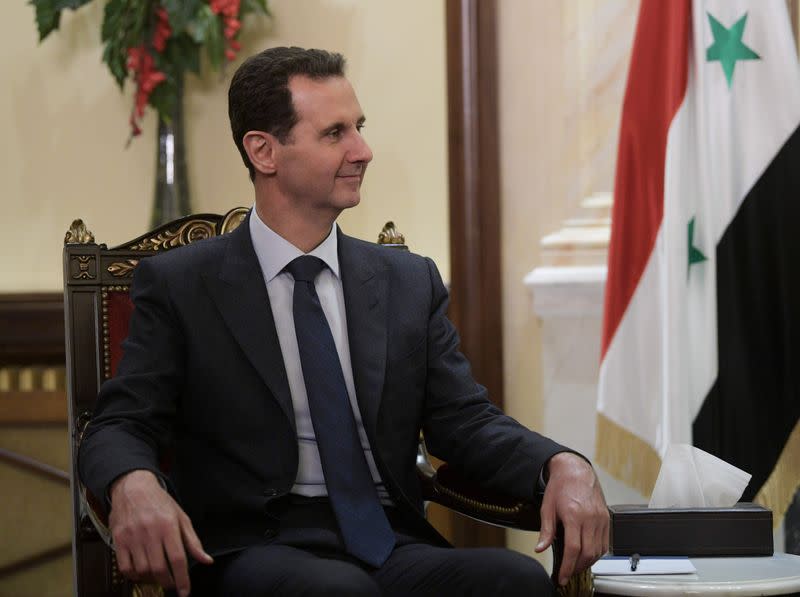 FILE PHOTO: Syrian President Assad meets his Russian counterpart Putin in Damascus