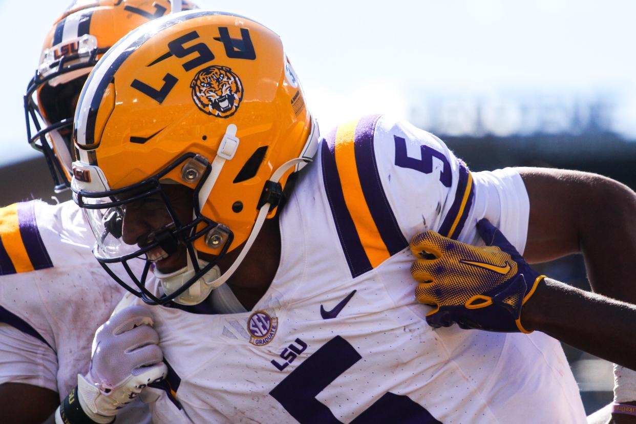 LSU quarterback Jayden Daniels (5) smiles after he scores a touchdown during Missouri's game against LSU at Faurot Field on Oct. 7, 2023, in Columbia, Mo.