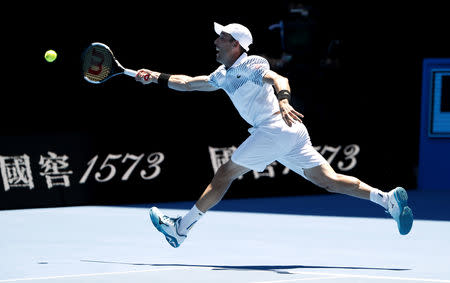 Tennis - Australian Open - Quarter-final - Melbourne Park, Melbourne, Australia, January 22, 2019. Spain's Roberto Bautista Agut in action with Greece's Stefanos Tsitsipas. REUTERS/Adnan Abidi