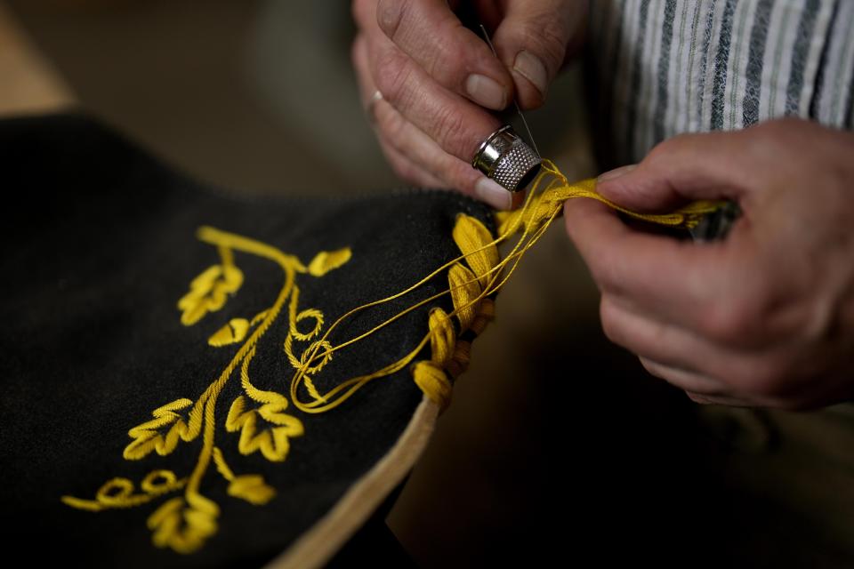 Saddler Klaus Bensmann works in his store in Bad Hindelang, Germany, Wednesday, Sept. 13, 2023. Bensmann produces tailored leather trousers and vests with hand embroidery. The leather comes from the alpine region and is tanned in Germany. For the upcoming Oktoberfest, many visitors like to wear the traditional dress. The 189th Oktoberfest, the world's biggest beer festival, runs from Sept. 16 through Oct. 3, 2023.(AP Photo/Matthias Schrader)