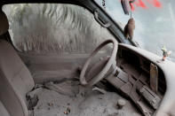 <p>A car is seen covered in ash after the eruption of the Fuego volcano at San Miguel Los Lotes in Escuintla, Guatemala, June 10, 2018. (Photo: Carlos Jasso/Reuters) </p>