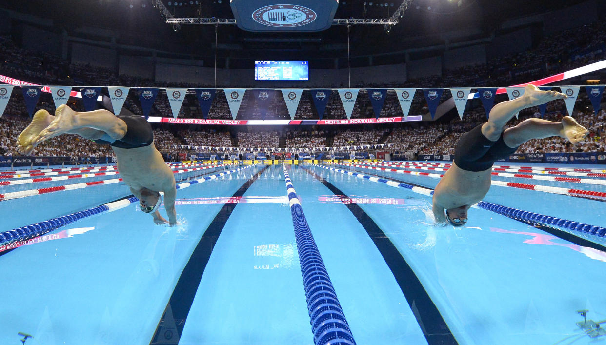 In this July 1, 2016, file photo, Michael Phelps, left, and Ryan Lochte start the men’s 200-meter individual medley at the U.S. Olympic swimming trials, in Omaha, Neb. (AP)