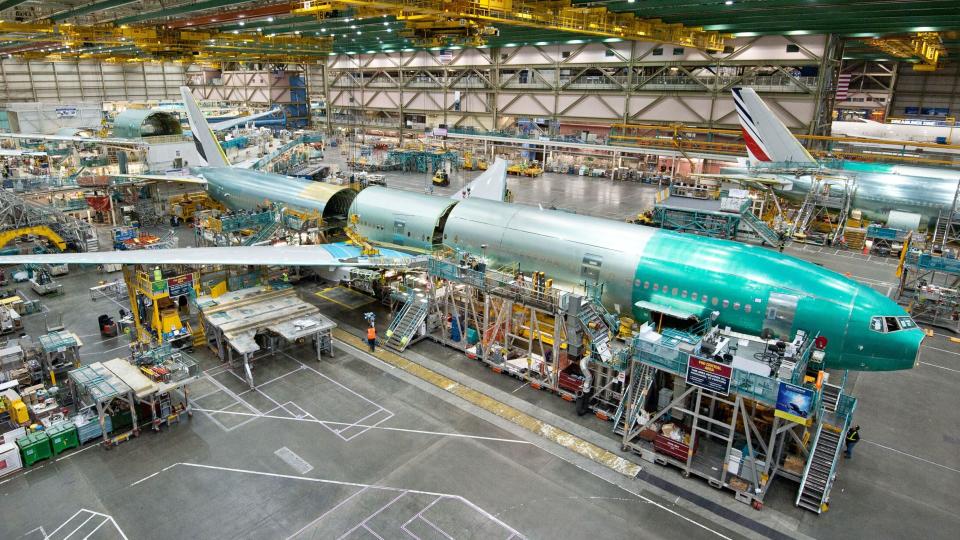 Fuselage and other components of a 777 jetliner are put together at a Boeing assembly plant.