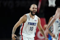 France's Evan Fournier (10) celebrates after making a 3-point basket during a men's basketball semifinal round game against Slovenia at the 2020 Summer Olympics, Thursday, Aug. 5, 2021, in Saitama, Japan. (AP Photo/Charlie Neibergall)