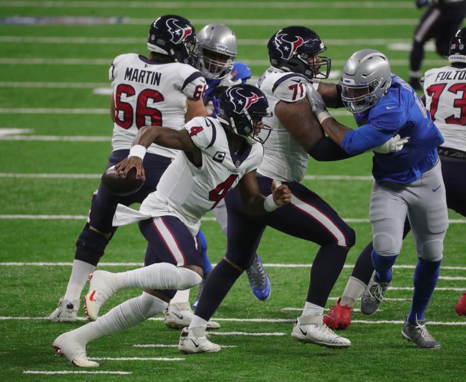 Lions defensive end Romeo Okwara, right, rushes Texans quarterback Deshaun Watson during the first half at Ford Field on Thursday, Nov  26, 2020.