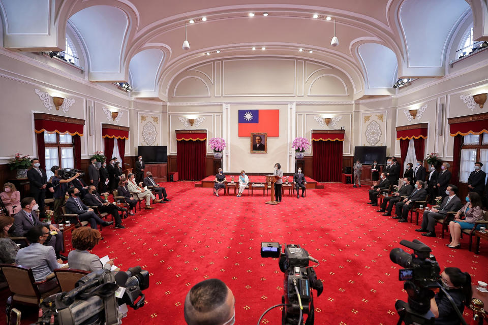 In this photo released by the Taiwan Presidential Office, Taiwanese President President Tsai Ing-wen, standing, speaks during a meeting with U.S. House Speaker Nancy Pelosi and other members of Congress in Taipei, Taiwan, Wednesday, Aug. 3, 2022. U.S. House Speaker Nancy Pelosi, meeting top officials in Taiwan despite warnings from China, said Wednesday that she and other congressional leaders in a visiting delegation are showing they will not abandon their commitment to the self-governing island. (Taiwan Presidential Office via AP)