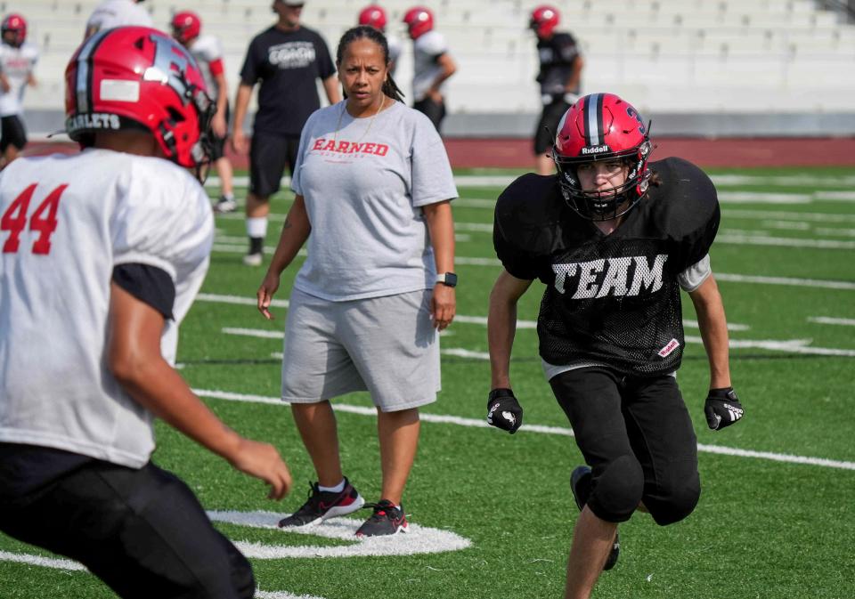 Des Moines East assistant coach Renate Rice watches her players run drills during preseason practice earlier this month