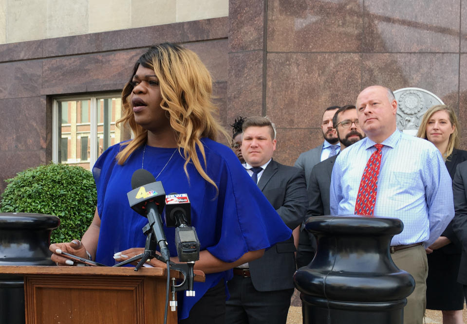 Lead plaintiff Kayla Gore speaks at a news conference outside the federal courthouse in Nashville, Tenn., Tuesday, April 23, 2019. She announced a lawsuit challenging a Tennessee statute that prohibits transgender people from changing the gender listed on their birth certificates. (AP Photo/Travis Loller)