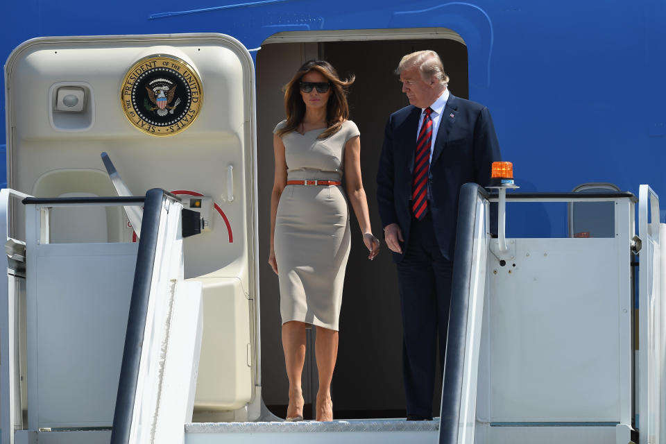 The first couple landed in England, with Melania taking a fashion cue from Meghan Markle. (Photo: Getty Images)