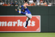 Toronto Blue Jays shortstop Bo Bichette leaps but cannot catch a ball that went for a single by Baltimore Orioles' Ryan McKenna during the third inning of a baseball game, Monday, Aug. 8, 2022, in Baltimore. (AP Photo/Nick Wass)