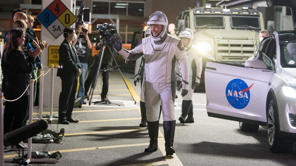 NASA astronauts Kjell Lindgren, Robert Hines, Jessica Watkins, and ESA (European Space Agency) astronaut Samantha Cristoforetti, wearing SpaceX spacesuits, are seen as they prepare to depart the Neil A. Armstrong Operations and Checkout Building for Launch Complex 39A to board the SpaceX Crew Dragon spacecraft for the Crew-4 mission launch, Tuesday, April 26, 2022, at NASA’s Kennedy Space Center in Florida