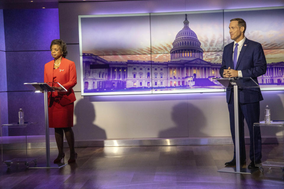 Democratic candidate for U.S. Senate Cheri Beasley, left, and Republican challenger U.S. Rep. Ted Budd, R-N.C. answer questions during a televised debate, Friday, Oct. 7, 2022, at Spectrum News 1 studio in Raleigh, N.C. (Travis Long/The News & Observer via AP, Pool)