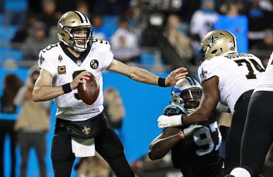 New Orleans Saints' Drew Brees (9) scrambles against the Carolina Panthers in the first half of an NFL football game in Charlotte, N.C., Monday, Dec. 17, 2018. (AP Photo/Jason E. Miczek)