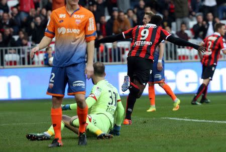 Football Soccer - Nice v Dijon - French Ligue 1 - Allianz Riviera stadium, Nice, France 18/12/16. Nice's Mario Balotelli reacts after scoring against Dijon's goalkeeper Reynet Baptiste. REUTERS/Eric Gaillard