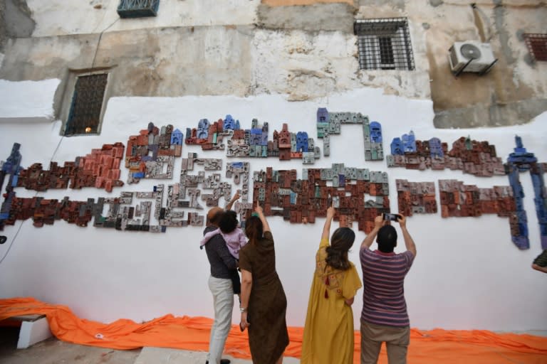 '1001 Bricks' took shape over a year through workshops that culminated in a large bas-relief made of carved and painted clay bricks, in the old medina of Tunis (FETHI BELAID)