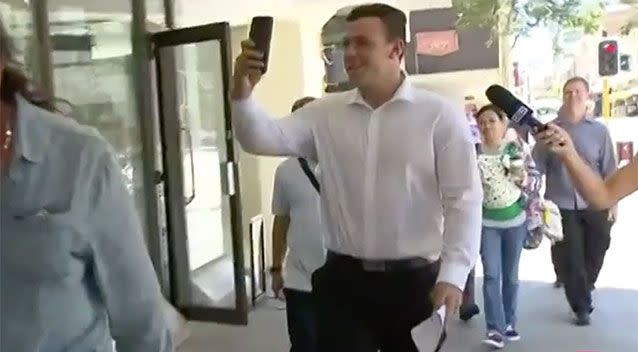 Mr Thomas takes smiling selfies after being handed a suspended sentence. Source: 7 News