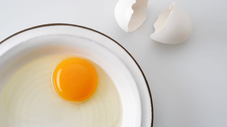 raw egg on small plate